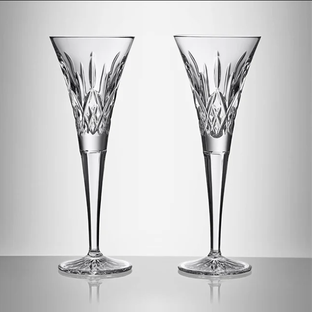 Two crystal glasses on a light gray background