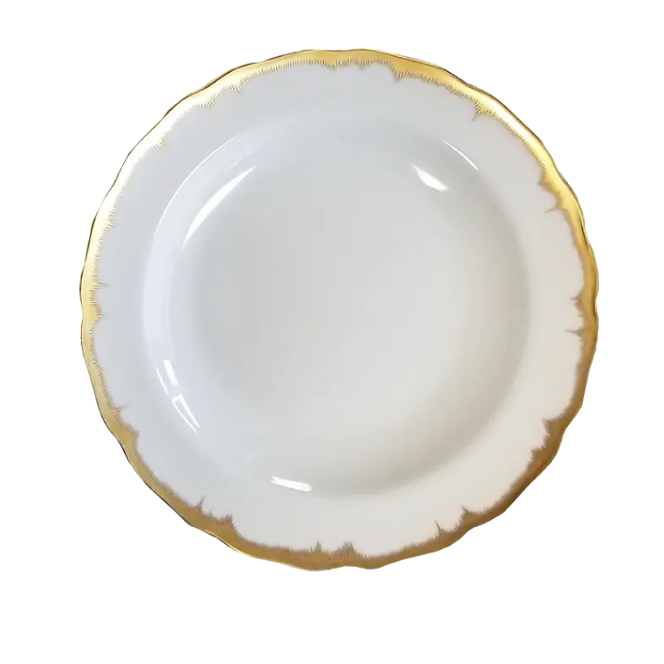 White plate with gold rim on a white background